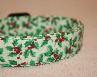 May include: A white dog collar with a green and red holly pattern.