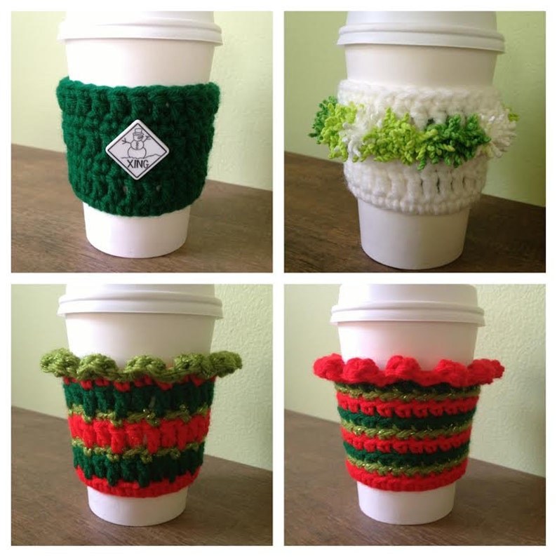 May include: Four different crocheted coffee cup cozies in various colors and patterns. The cozies are green, white, red, and green, and feature different designs, including a snowman, pom-poms, and a ruffled edge.