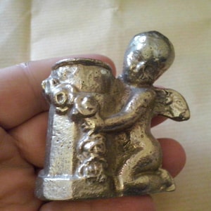 solid iron statue, candle holder, miniature cupid, small angel embracing a well, small angel statue, nude angel syr2 image 1