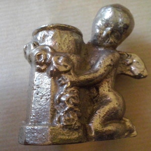 solid iron statue, candle holder, miniature cupid, small angel embracing a well, small angel statue, nude angel syr2 image 4