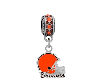 May include: A silver charm with orange and brown enamel depicting a football helmet with the word "Browns" underneath. The charm has a silver bead with orange crystals.
