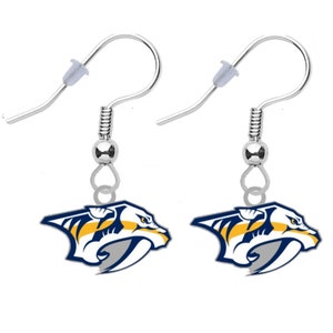 May include: A pair of silver dangle earrings featuring the Nashville Predators NHL team logo. The logo is a blue, yellow, and gray stylized predator head with a white outline.