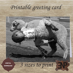 May include: A black and white photo of a child holding onto a sheep during a sheep-riding competition. The child is wearing a helmet and has the number "892" on their back. The photo is suitable for a greeting card.