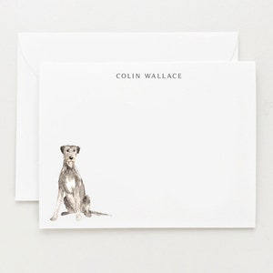 May include: A white card with a gray and white illustration of a dog sitting. The text "COLIN WALLACE" is printed in black at the top of the card.