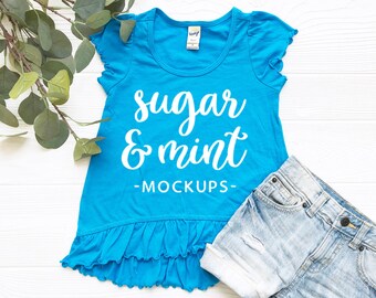 Download Free Infant Toddler T Shirt Flay Lay, Kavio Ruffle Mockup in Island Blue PSD Template