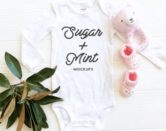 Download Free White Baby Bodysuit Mockup, Long Sleeve Baby Flat Lay PSD Template