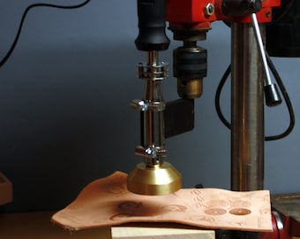 Holder heating branding iron to the bench drills