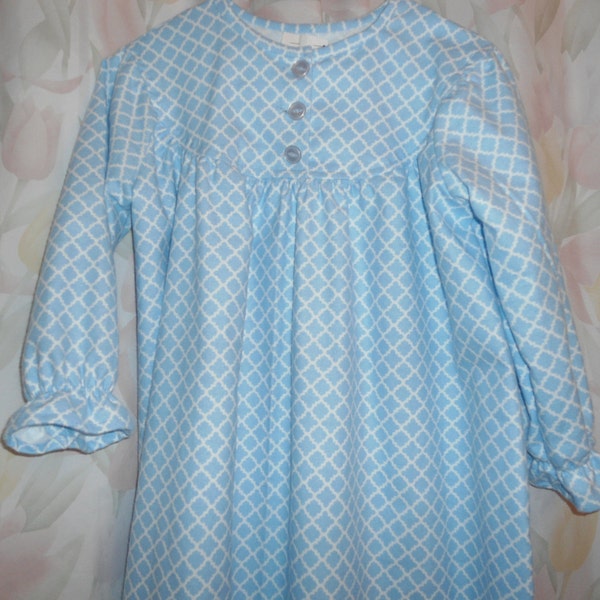Girls size 10 gown in blue squares on white back ground
