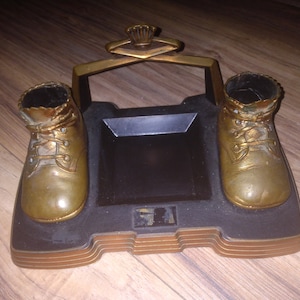 Vintage bronze baby shoes display