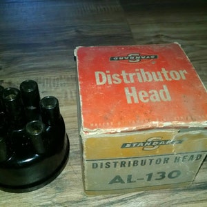 New old stock Standard AL-130 Distributor Cap Head in original box. Unused