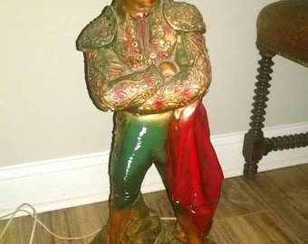Mid century modern matador bullfighter lamp with Spanish inspired original red velvet lampshade. Chalkware large and heavy.