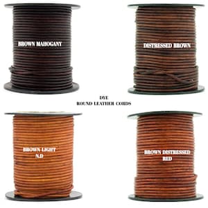 May include: Four spools of round leather cord in different shades of brown. The cords are labeled "Brown Mahogany", "Distressed Brown", "Brown Light N.D.", and "Brown Distressed Red".