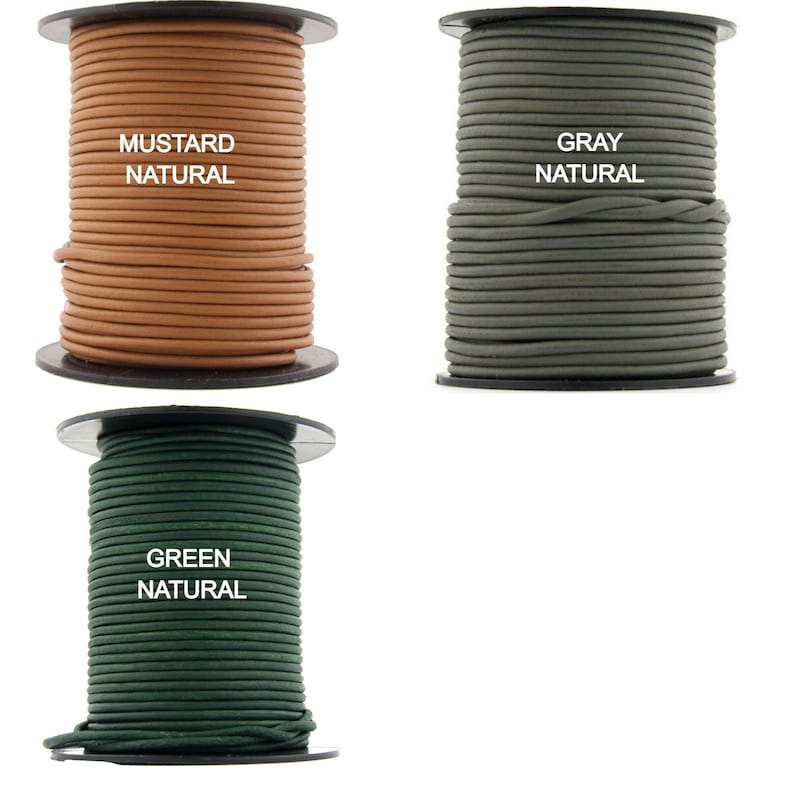 May include: Three spools of leather cord in mustard, gray, and green. Each spool is labeled with the color and "natural".
