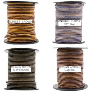 May include: Four spools of leather cord in different colors and finishes.  The spools are labeled "Sunset Brown", "Antique Purple Natural", "Military Green Distressed", and "Brown Antique Natural".