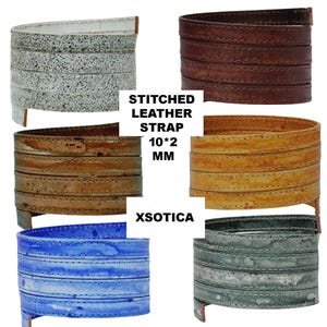 May include: A collection of stitched leather straps in various colors, including white, brown, tan, blue, and gray. Each strap is approximately 10mm wide and features visible stitching. The text "STITCHED LEATHER STRAP 10*2 MM X SOTICA" is also present.