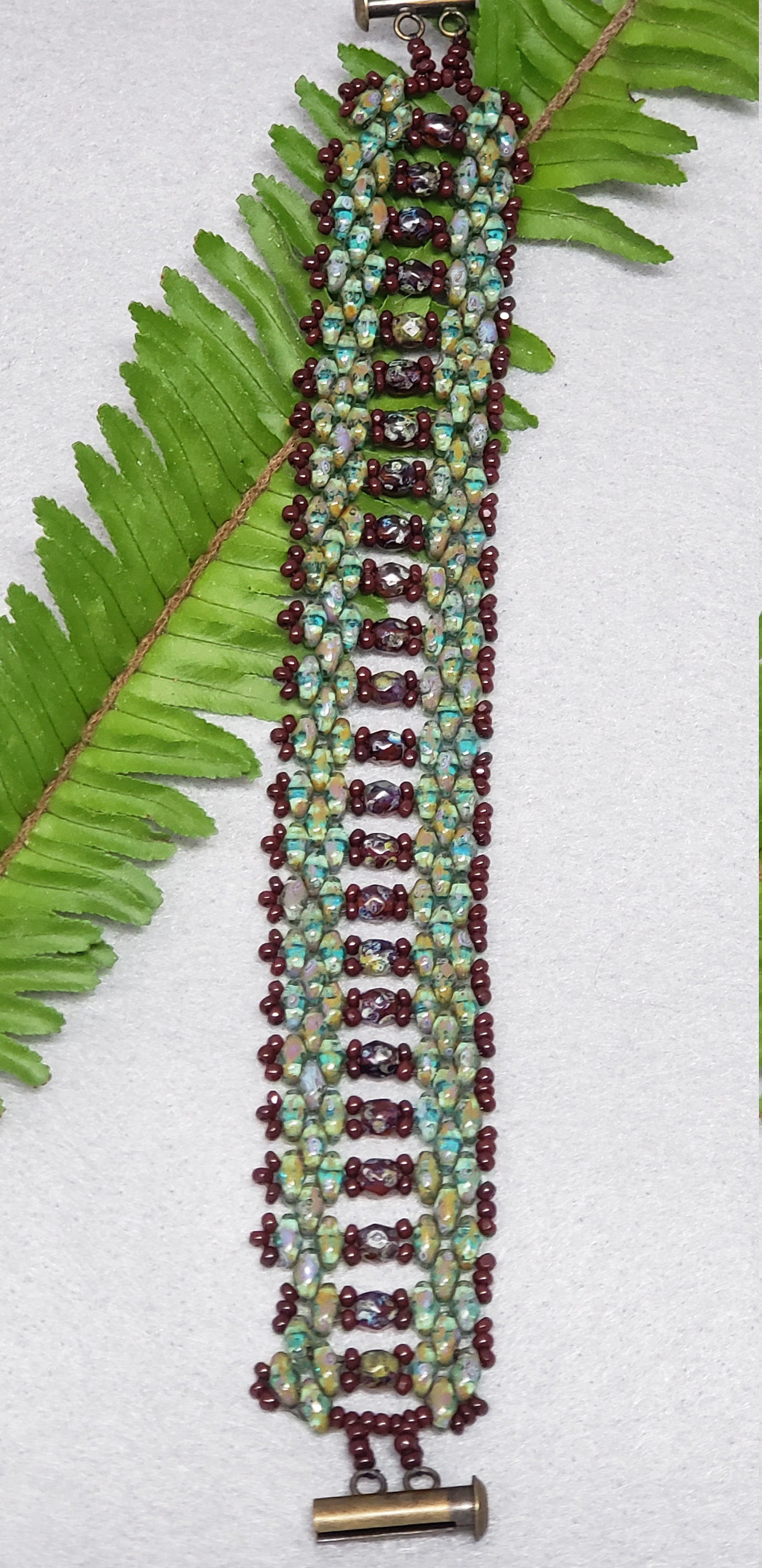Greenish Turquoise and Maroon Bracelet with Center Accent