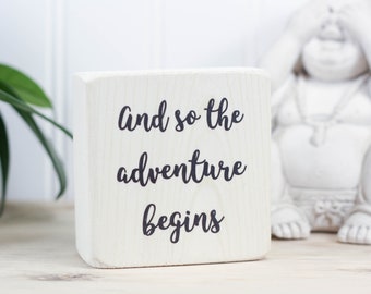 Small whitewashed wood sign for a desk or shelf, Housewarming or bon voyage gift, Wedding or engagement present, And so the adventure begins