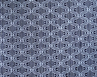 May include: A seamless pattern of white geometric shapes on a dark blue background. The pattern is made up of repeating diamonds and squares.