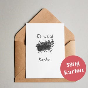 Peut inclure: Une carte blanche avec du texte manuscrit noir à l'intérieur d'une enveloppe marron. Le texte se lit "Es wird Leichter besser Kacke." Un cercle rouge avec le texte "580g Karton" est dans le coin inférieur droit.