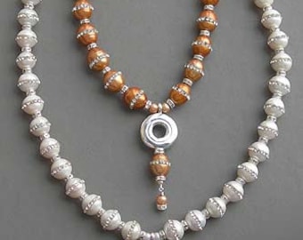 Solid Sterling Silver Open Hole Flute Key on a Necklace of CZ Pearls