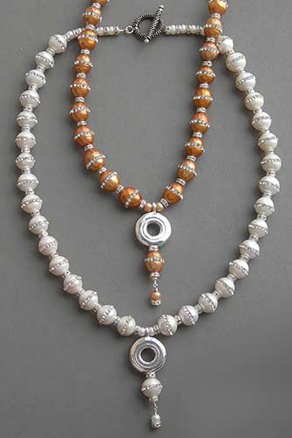 An Open Hole Key on a Necklace of CZ Pearls