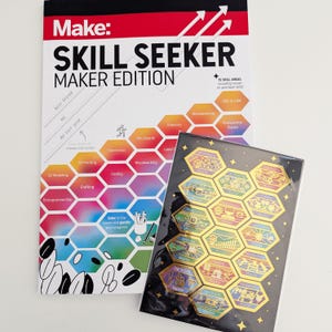 May include: A colorful guide titled "Make: Skill Seeker Maker Edition" with a honeycomb pattern featuring 15 skill areas, including hands-on and tech skills. The guide is next to a black background with gold hexagonal pins featuring different skills, such as 3D modeling, coding, and woodworking.