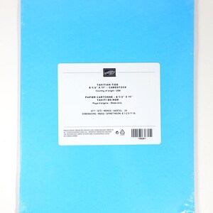 May include: A pack of Tahitian Tide cardstock paper, measuring 21.6 x 27.9 cm, is displayed. The paper is a bright blue colour and is wrapped in clear plastic. The label indicates the country of origin is the USA.