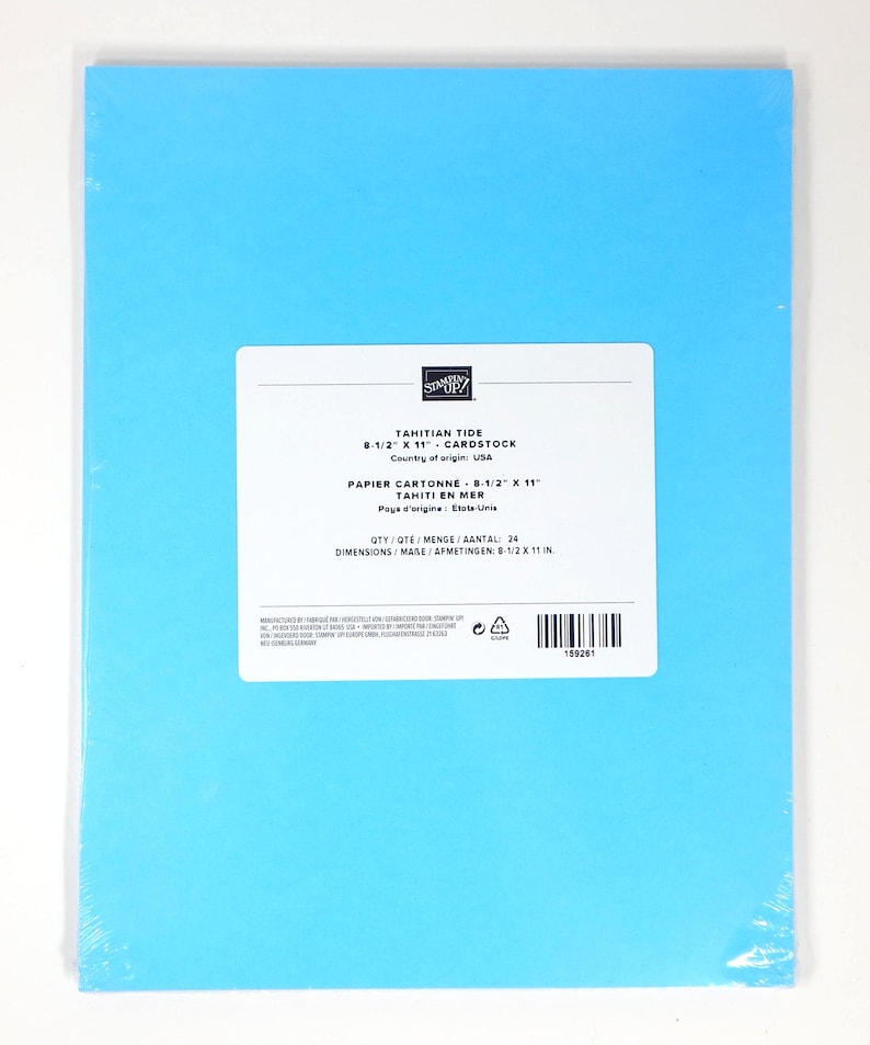 May include: A pack of Tahitian Tide cardstock paper, measuring 21.6 x 27.9 cm, is displayed. The paper is a bright blue colour and is wrapped in clear plastic. The label indicates the country of origin is the USA.