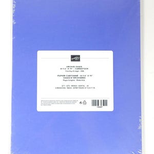 May include: A pack of Orchid Oasis cardstock paper in a light purple hue. The paper measures 21.6 x 27.9 cm. The packaging includes a white label with product information.