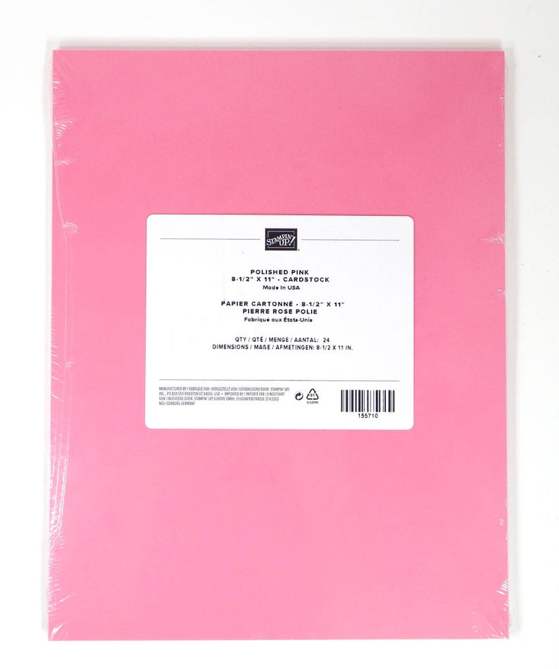 May include: A pack of polished pink cardstock paper, measuring 21.6 x 27.9 cm, wrapped in clear plastic. The label reads "Polished Pink" and "Cardstock". The paper is made in the USA.