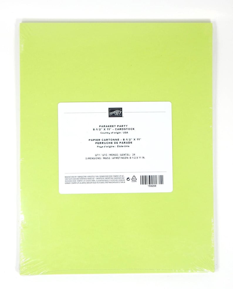 May include: A pack of bright green cardstock paper, measuring 21.6 x 27.9 cm, wrapped in clear plastic. The label reads "PARAKEET PARTY" and "CARDSTOCK". The quantity is 24 sheets. Made in the USA.