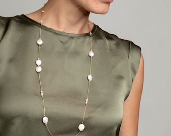 Dainty long gold filled necklace with white pearls in different shapes. Boho chic style