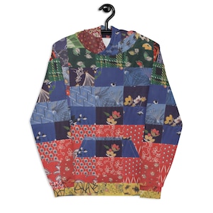 May include: A blue, red, and green patchwork hoodie with a variety of floral and geometric patterns.