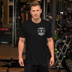 May include: A black t-shirt with a white graphic design that says "Sentenced to Life Behind Bars" with a skull and crossbones image.