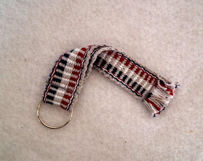 Red white gray blue cotton wrist strap with split ring attachment,