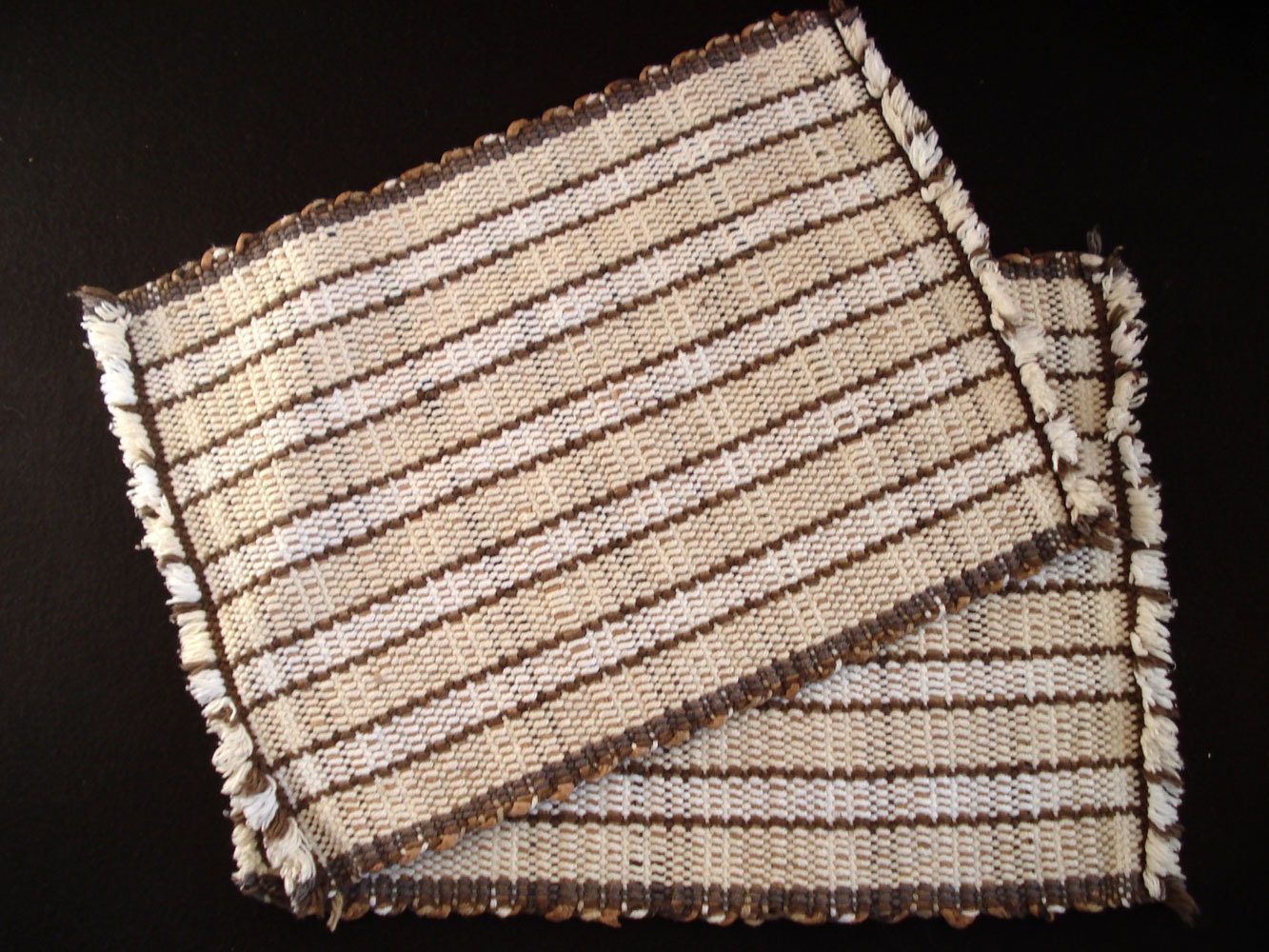 Pair of handwoven recycled plastic placemats, woven plarn placemats
