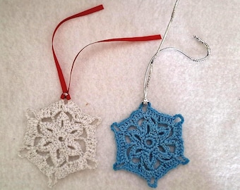 Victorian snowflake crocheted in white cotton with silver sparkle