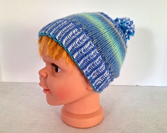Blue pompom hat, handknit for baby, pretty color-change pattern and striped ribbing, free fast shipping to US, easy care gift for baby
