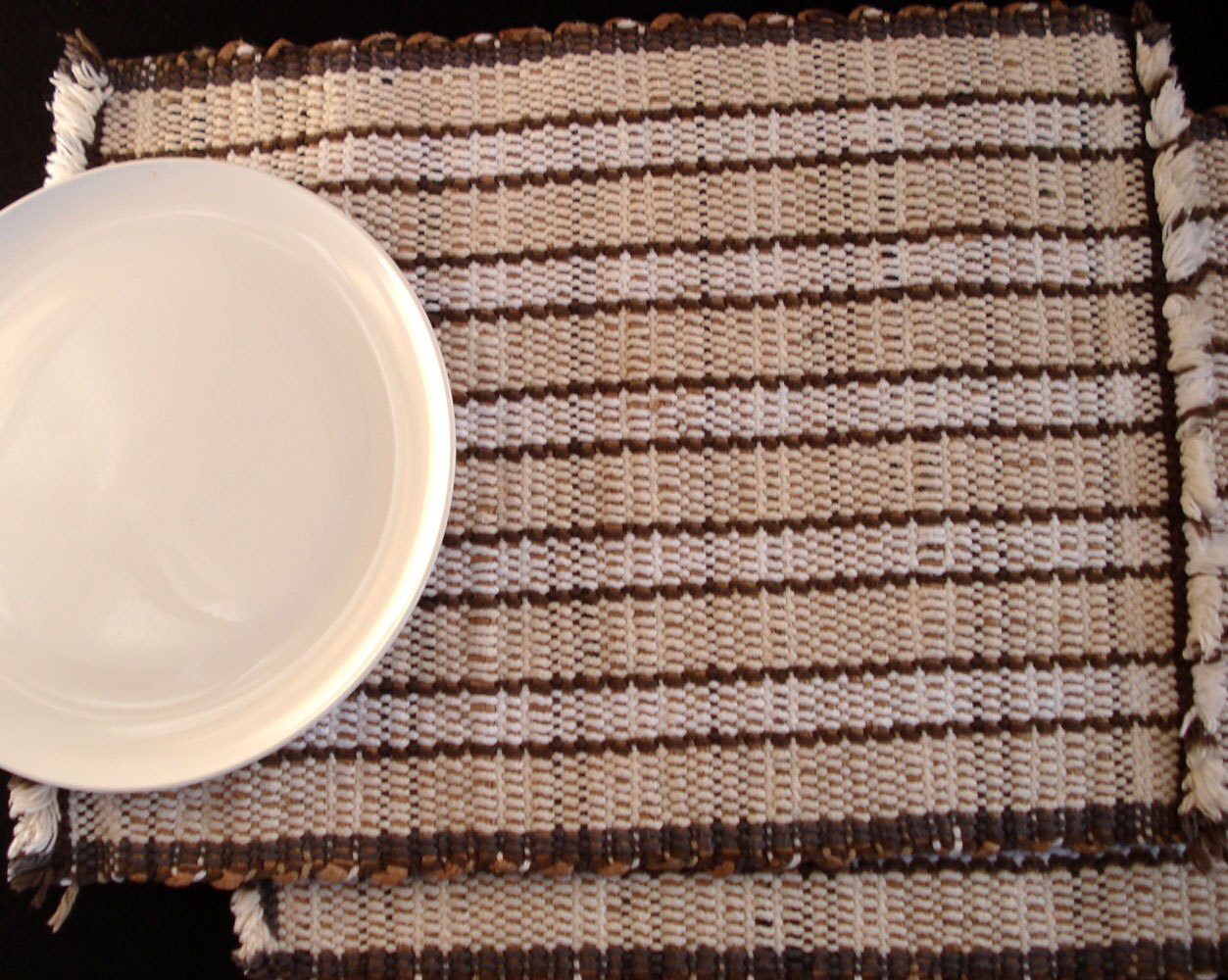 Pair of handwoven recycled plastic placemats, woven plarn placemats
