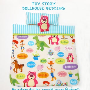 May include: Toy Story dollhouse bedding set with a white background and colorful characters from the movie. The bedding features characters like Woody, Buzz Lightyear, Jessie, and Lotso. The bedding is handmade and includes a pillow with blue and white stripes.