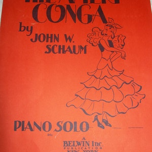 May include: A red sheet music cover with black text that reads "THE AMERI CONGA by JOHN W. SCHAUM PIANO SOLO 40c A BELWIN Inc. PUBLICATION NEW YORK". A black and white illustration of a woman in a dress and a flower in her hair is on the cover.