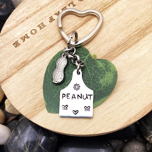 PEANUT KEYCHAIN personalized with hand stamped &quot;PEANUT&quot; with heart, butterflies, flowers - peanut measures 3/4 &quot; - cute keyring, zipper pull