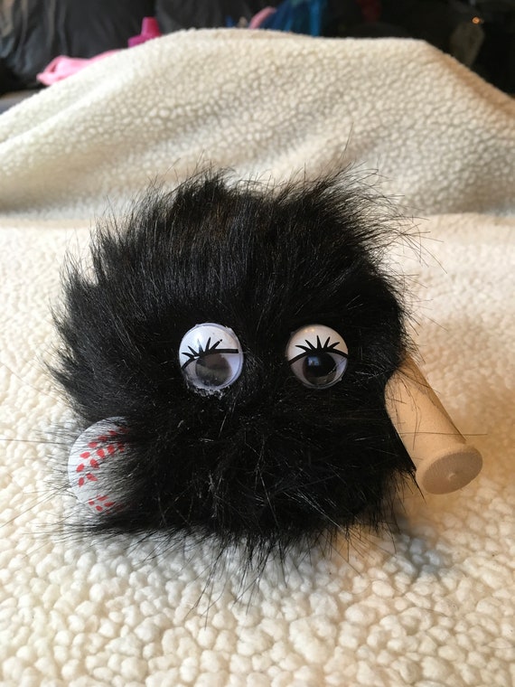bat hugging stuffed animal