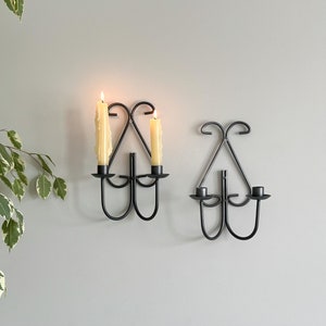 Vintage pair of ornate curved metal candlestick wall sconces, set of MCM wall mount cast iron candle holders, gothic brutalist style