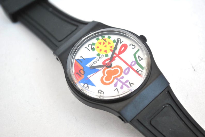 Reloj de pulsera colorido con diseño pop art: reloj de cuarzo con esfera gráfica y correa de caucho negra. Reloj unisex con estilo. imagen 3