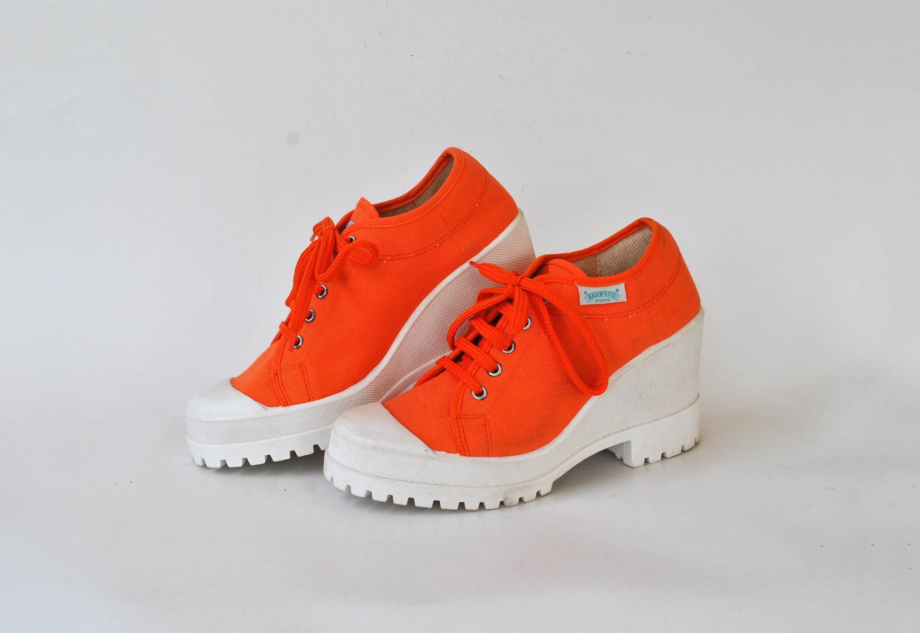 Orange platform trainers discount