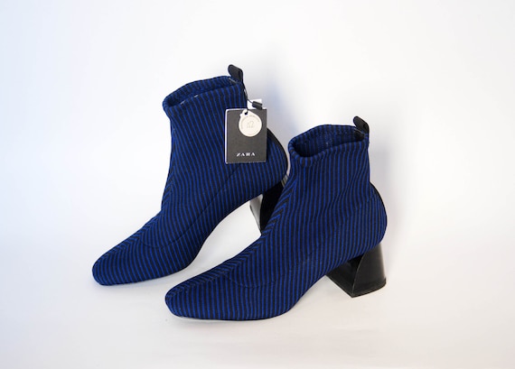 sock style heeled ankle boots with lug soles