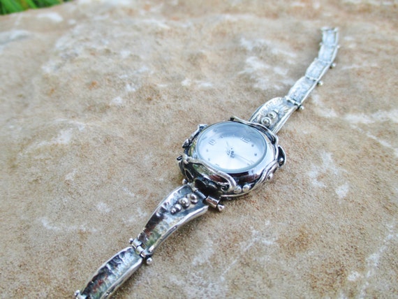 dainty silver watch