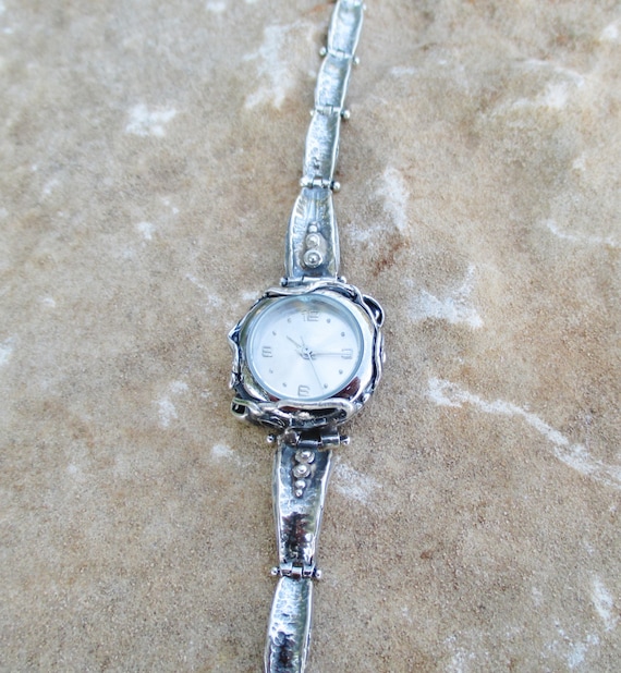 dainty silver watch