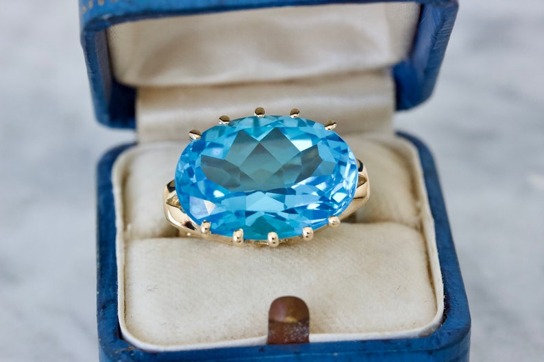 Bold 1990s Blue Topaz Cocktail Ring in 14k Yellow Gold, Size 6, Vintage Statement Rings, December Birthstone Jewelry, Oval Cut Gemstones image 1
